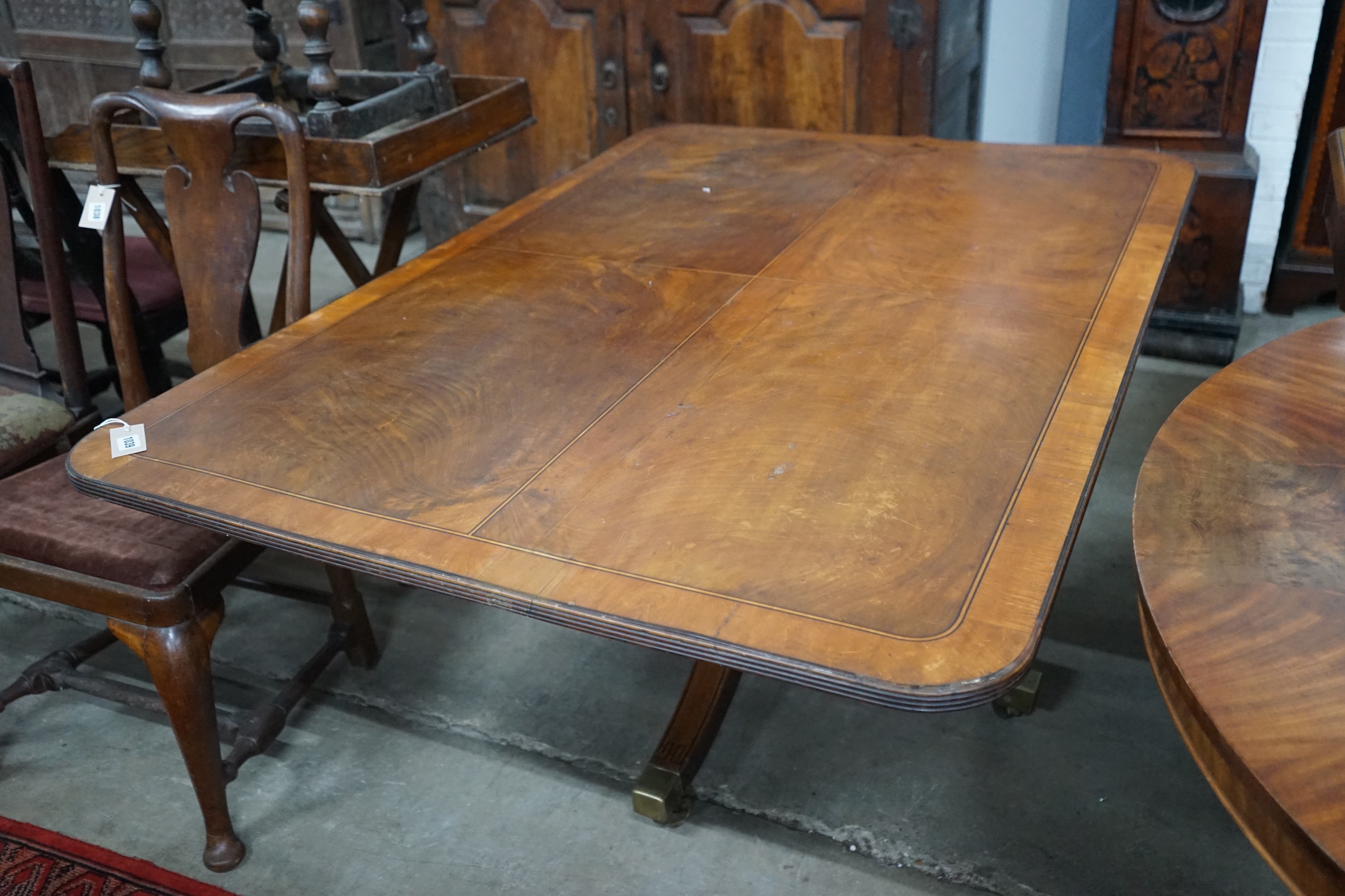 A George III satinwood banded rectangular mahogany tilt top dining table, length 152cm, depth 104cm, height 70cm